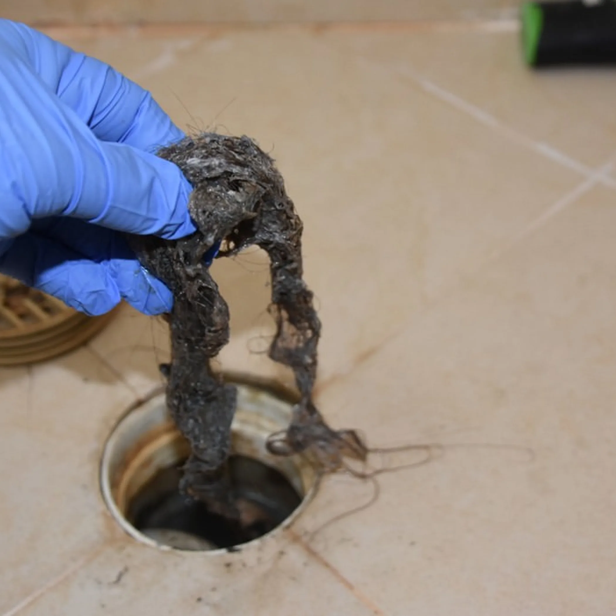 drain blockage being removed
