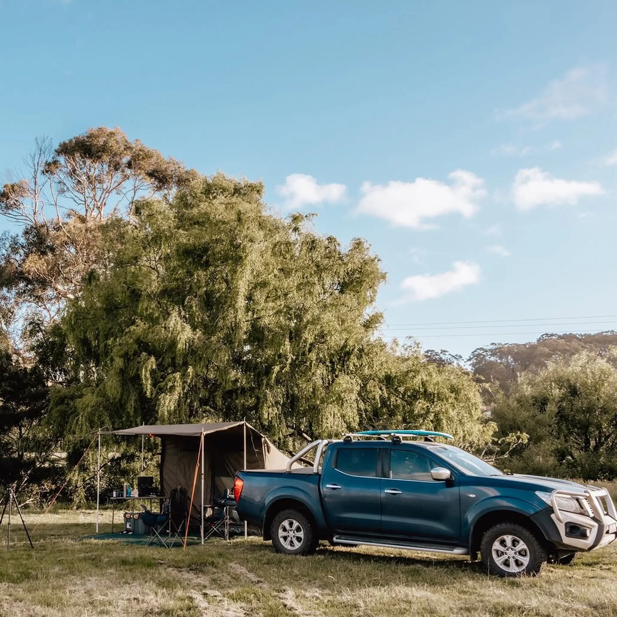 camping gear and vehicle on australian coast