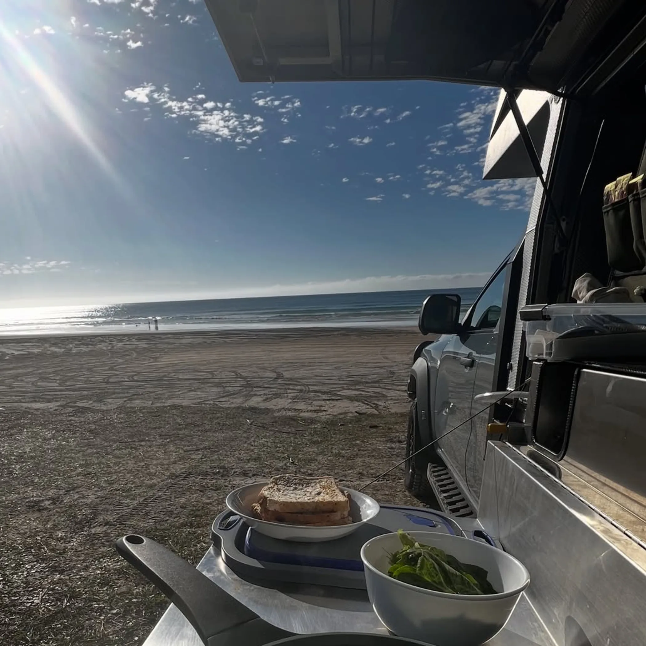 beach camping breakfast coastal view