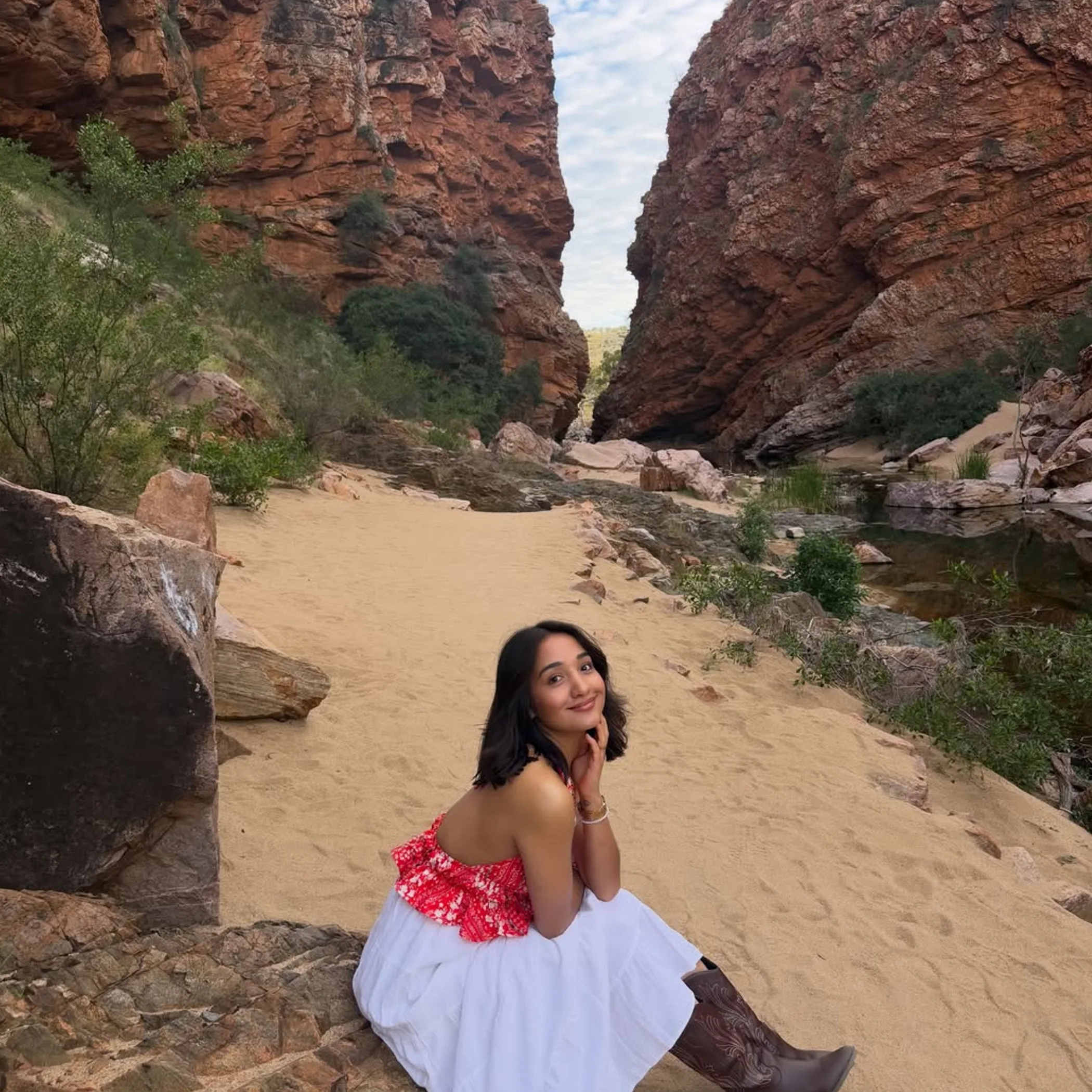 visitor walking through canyon